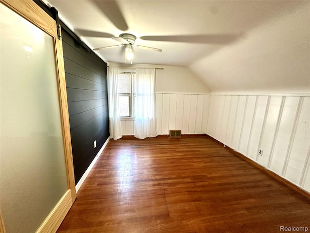 20979 Audette St, Dearborn, MI 48124 - additional living space featuring wood finished floors, a barn door, ceiling fan, and lofted ceiling