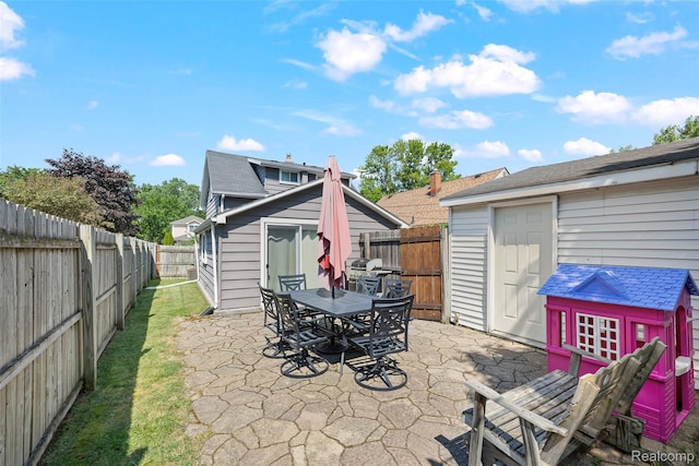 26752 Blackmar Ave, Warren, MI 48091 - fenced backyard featuring a patio, an outbuilding, and outdoor dining area