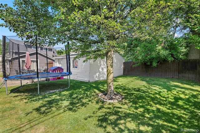 26752 Blackmar Ave, Warren, MI 48091 - fenced backyard featuring a trampoline and a storage unit