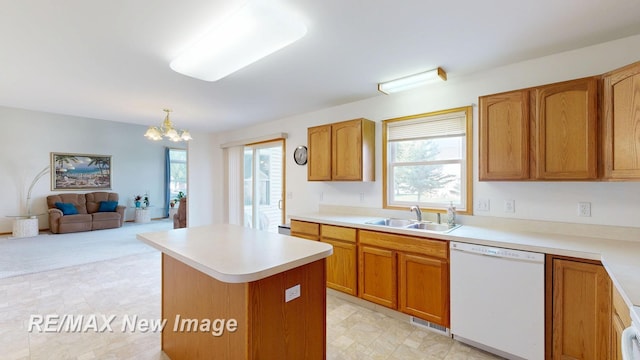 3200 Setting Sun Blvd, Saginaw, MI 48603 - kitchen featuring dishwasher, a chandelier, a kitchen island, light countertops, and open floor plan
