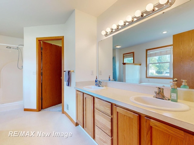 3200 Setting Sun Blvd, Saginaw, MI 48603 - bathroom with double vanity, a garden tub, and a shower