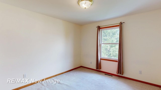 3200 Setting Sun Blvd, Saginaw, MI 48603 - spare room with light carpet and baseboards