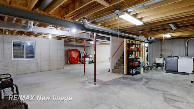 3200 Setting Sun Blvd, Saginaw, MI 48603 - unfinished below grade area featuring washer and dryer and stairs