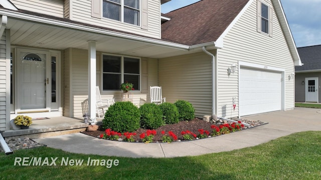 3200 Setting Sun Blvd, Saginaw, MI 48603 - doorway to property with a shingled roof, covered porch, and concrete driveway