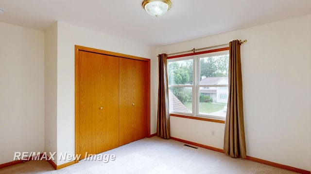 3200 Setting Sun Blvd, Saginaw, MI 48603 - unfurnished bedroom with a closet and light carpet