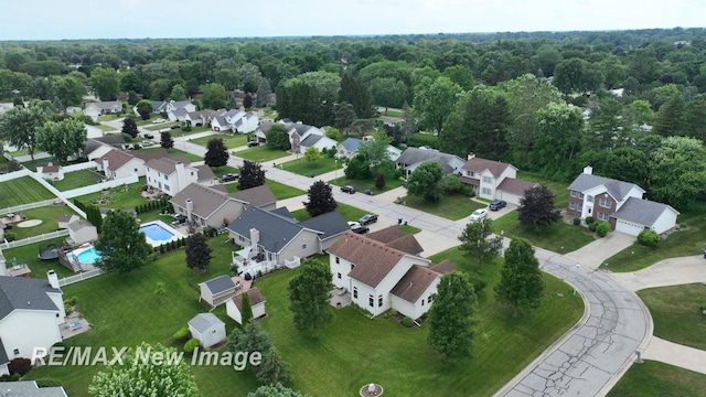 3200 Setting Sun Blvd, Saginaw, MI 48603 - aerial perspective of suburban area featuring a pool area and a forest