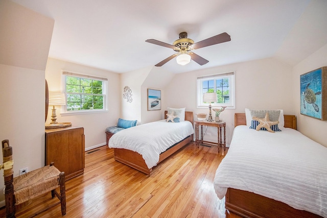 1507 Dicken Dr, Ann Arbor, MI 48103 - bedroom featuring vaulted ceiling, multiple windows, light wood-style floors, and ceiling fan