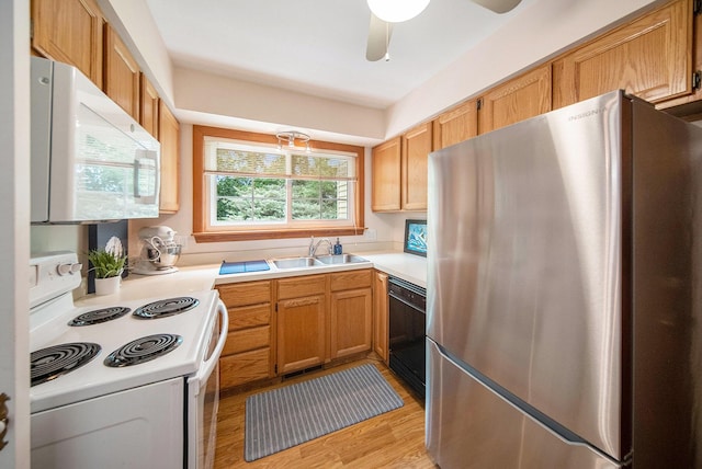 1507 Dicken Dr, Ann Arbor, MI 48103 - kitchen featuring white appliances, light countertops, light wood-style floors, and ceiling fan