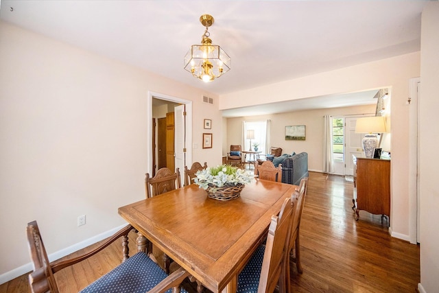 1507 Dicken Dr, Ann Arbor, MI 48103 - dining space featuring wood finished floors and a chandelier
