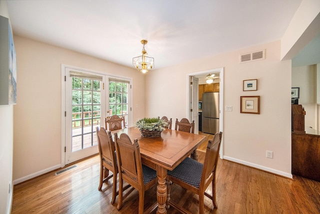 1507 Dicken Dr, Ann Arbor, MI 48103 - dining space featuring light wood-style flooring, a chandelier, and ceiling fan