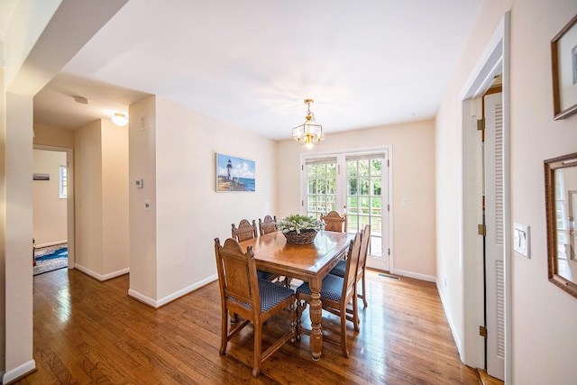 1507 Dicken Dr, Ann Arbor, MI 48103 - dining room featuring wood finished floors and a chandelier