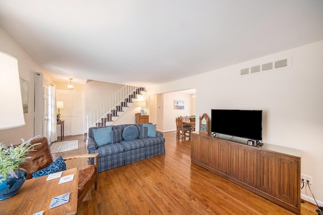 1507 Dicken Dr, Ann Arbor, MI 48103 - living area with stairway and light wood-style flooring