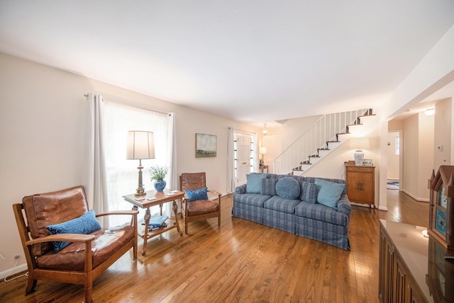 1507 Dicken Dr, Ann Arbor, MI 48103 - living room featuring light wood finished floors and stairway