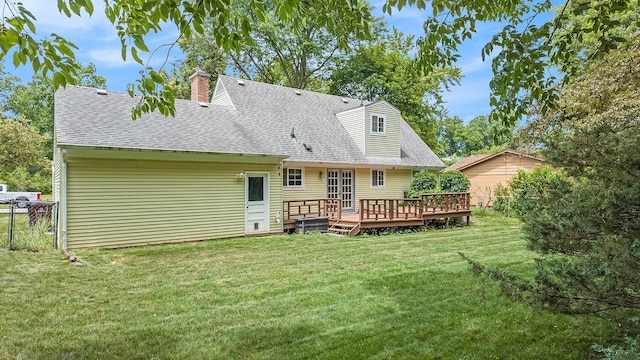 1507 Dicken Dr, Ann Arbor, MI 48103 - rear view of property with a shingled roof, a wooden deck, and a chimney