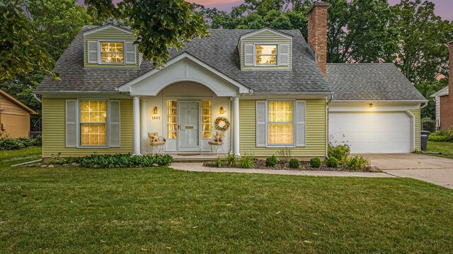 1507 Dicken Dr, Ann Arbor, MI 48103 - view of front facade with a chimney, an attached garage, driveway, roof with shingles, and a front lawn