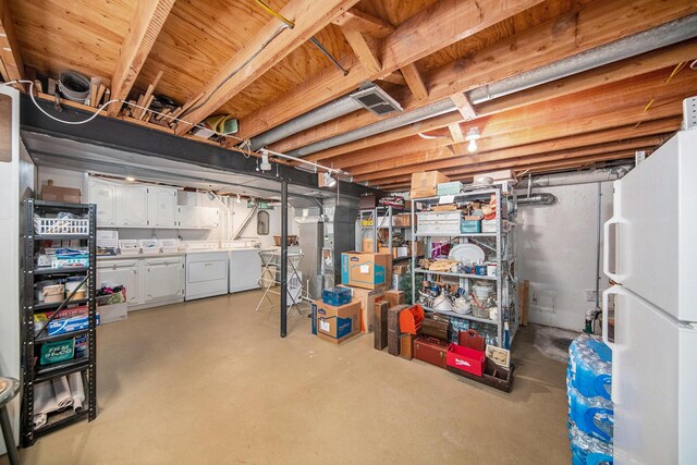 1507 Dicken Dr, Ann Arbor, MI 48103 - unfinished below grade area with washer and clothes dryer and freestanding refrigerator