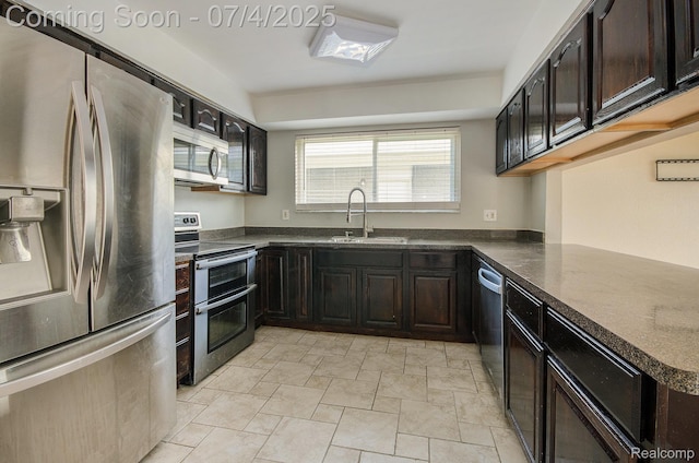 37718 Douglas Ct, Sterling Heights, MI 48310 - kitchen featuring appliances with stainless steel finishes, light stone finish flooring, and dark brown cabinetry