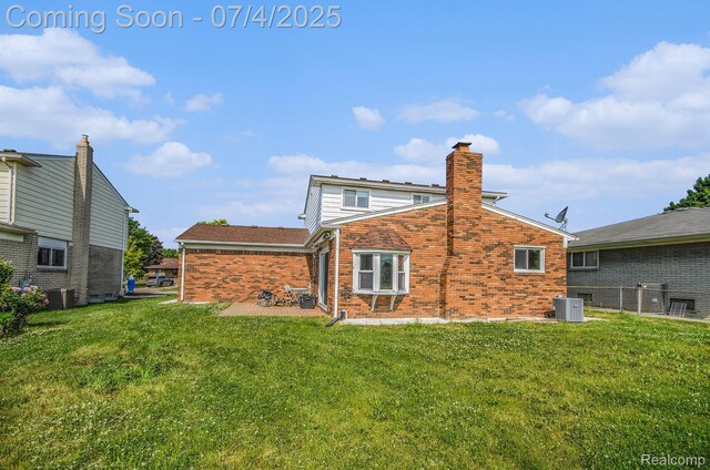 37718 Douglas Ct, Sterling Heights, MI 48310 - back of property featuring brick siding, a lawn, a patio area, and a chimney