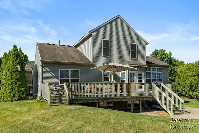 5322 S Silverstone Dr NE, Comstock Park, MI 49321 - rear view of property with a yard, a wooden deck, and roof with shingles