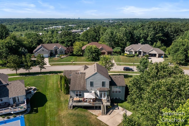 5322 S Silverstone Dr NE, Comstock Park, MI 49321 - aerial view of residential area featuring a forest