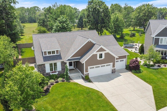 1560 Marksbury Ct, Byron Center, MI 49315 - craftsman house featuring stone siding, an attached garage, driveway, a shingled roof, and board and batten siding