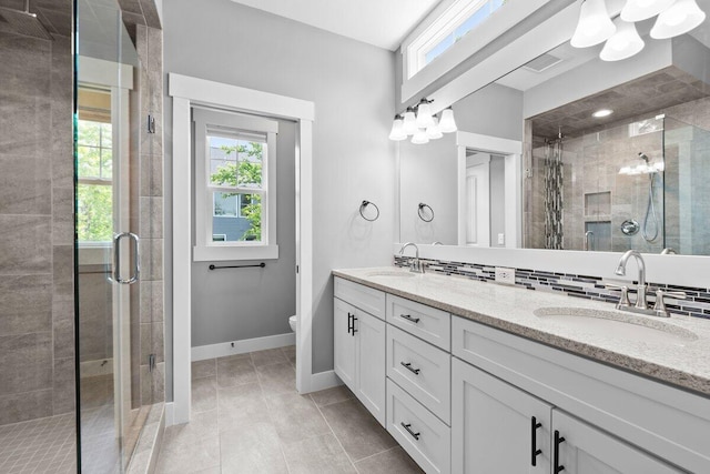 1560 Marksbury Ct, Byron Center, MI 49315 - bathroom with a shower stall, double vanity, and tile patterned floors