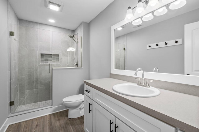 1560 Marksbury Ct, Byron Center, MI 49315 - full bathroom featuring wood finished floors, vanity, and a shower stall