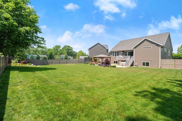 1560 Marksbury Ct, Byron Center, MI 49315 - fenced backyard featuring a gazebo, stairs, and a deck
