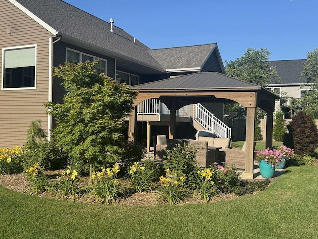 1560 Marksbury Ct, Byron Center, MI 49315 - view of side of home featuring a gazebo, a lawn, and a shingled roof