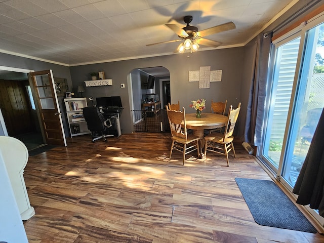 8991 W 1 Mile Rd, Hesperia, MI 49421 - dining space with arched walkways, a ceiling fan, wood finished floors, crown molding, and an office area