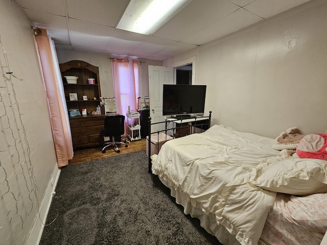 8991 W 1 Mile Rd, Hesperia, MI 49421 - bedroom featuring a drop ceiling, an office area, and dark wood-style floors