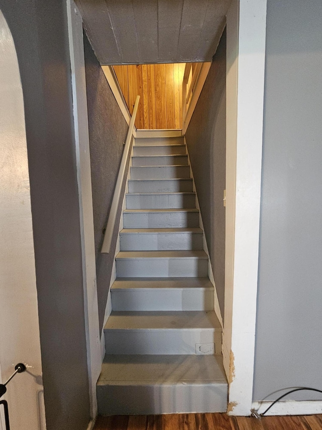 8991 W 1 Mile Rd, Hesperia, MI 49421 - staircase with arched walkways and wood finished floors