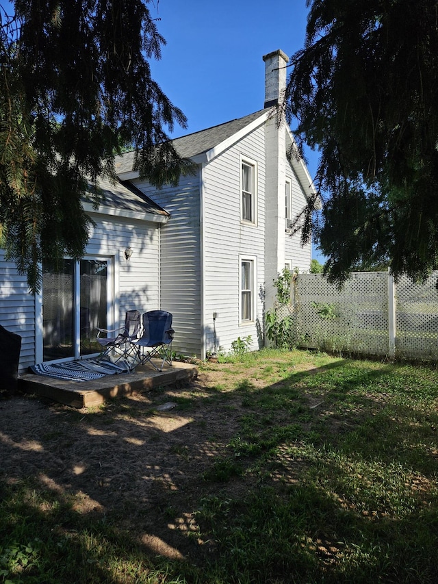 8991 W 1 Mile Rd, Hesperia, MI 49421 - back of property featuring a deck and a chimney