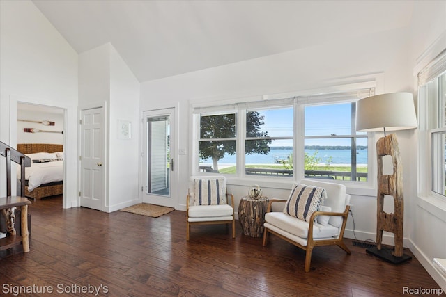 4294 N E Torch Lake Dr, Central Lake, MI 49622 - sitting room with lofted ceiling, dark wood-style floors, and a water view