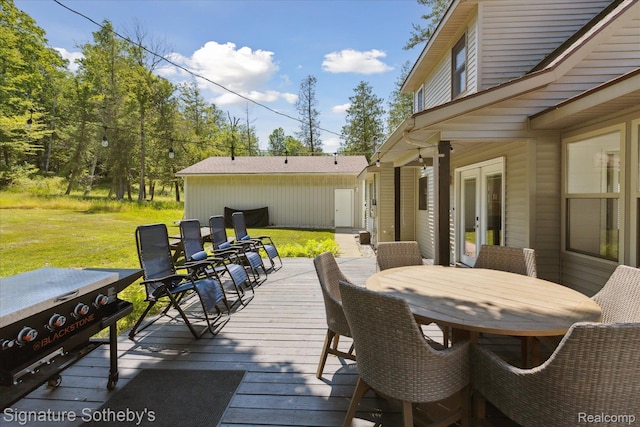 4294 N E Torch Lake Dr, Central Lake, MI 49622 - wooden deck featuring french doors, a yard, outdoor dining area, and area for grilling