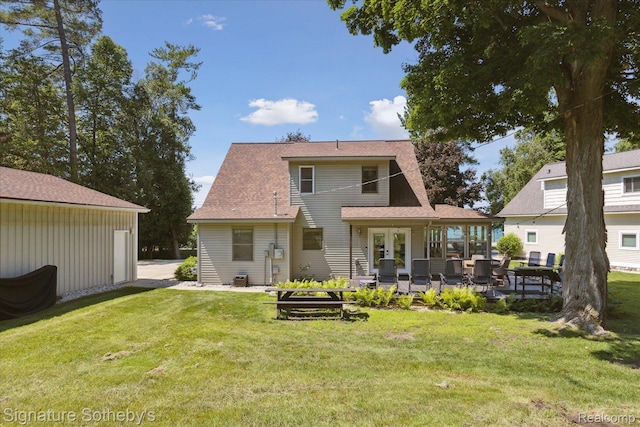 4294 N E Torch Lake Dr, Central Lake, MI 49622 - rear view of property featuring a patio, a yard, and french doors