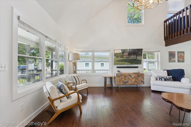 4294 N E Torch Lake Dr, Central Lake, MI 49622 - living area with high vaulted ceiling, hardwood / wood-style floors, a chandelier, and healthy amount of natural light