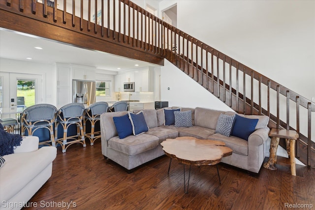 4294 N E Torch Lake Dr, Central Lake, MI 49622 - living area featuring dark wood-type flooring, plenty of natural light, stairway, recessed lighting, and a towering ceiling