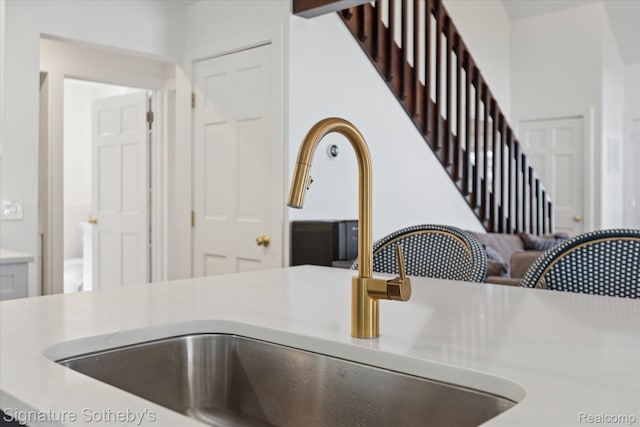 4294 N E Torch Lake Dr, Central Lake, MI 49622 - kitchen view of a sink and light countertops