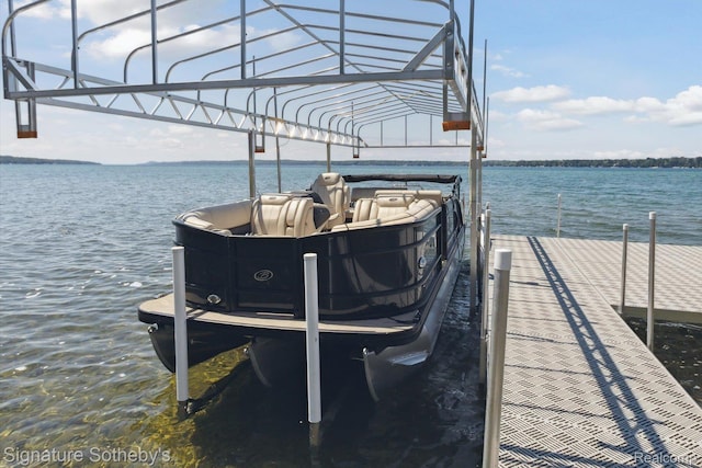 4294 N E Torch Lake Dr, Central Lake, MI 49622 - dock featuring boat lift and a water view