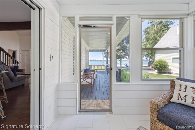 4294 N E Torch Lake Dr, Central Lake, MI 49622 - sunroom with a water view