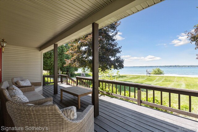 4294 N E Torch Lake Dr, Central Lake, MI 49622 - wooden terrace featuring a water view and a yard