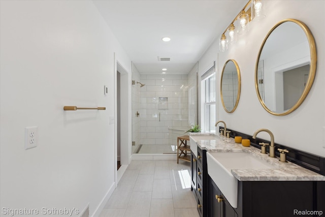 4294 N E Torch Lake Dr, Central Lake, MI 49622 - bathroom with double vanity, a stall shower, tile patterned floors, and recessed lighting