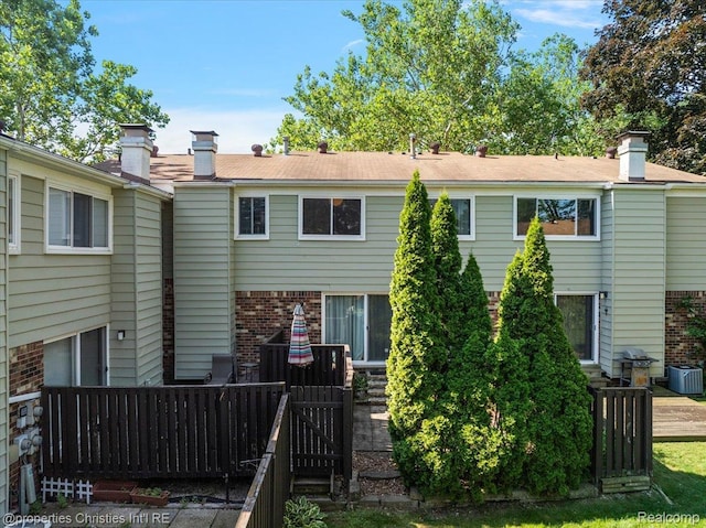 1982 Wickham St, Royal Oak, MI 48073 - rear view of property featuring brick siding and a chimney