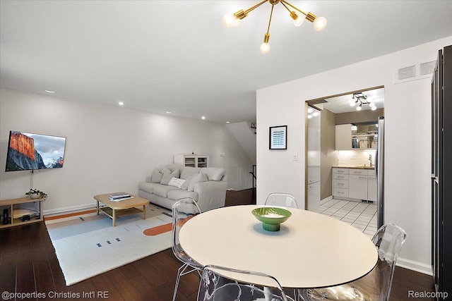 1982 Wickham St, Royal Oak, MI 48073 - dining space with hardwood / wood-style flooring and a chandelier
