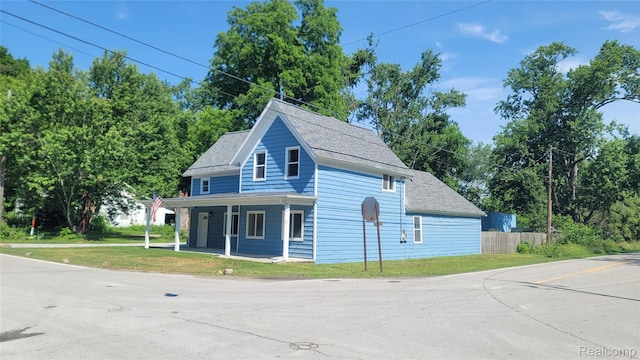 9630 Lambs Rd, Goodells, MI 48027 - view of front of home featuring a porch and roof with shingles