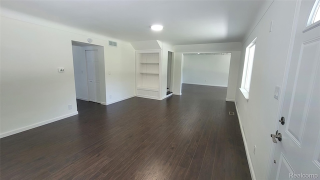 9630 Lambs Rd, Goodells, MI 48027 - unfurnished room with dark wood-type flooring