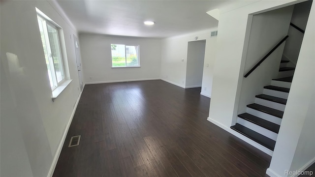 9630 Lambs Rd, Goodells, MI 48027 - spare room featuring dark wood-type flooring and stairway