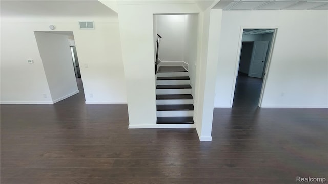 9630 Lambs Rd, Goodells, MI 48027 - staircase featuring wood finished floors and baseboards
