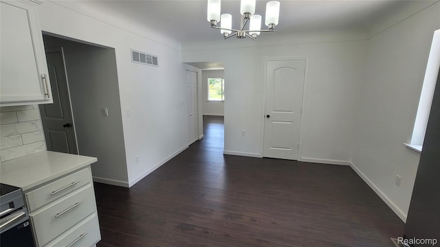 9630 Lambs Rd, Goodells, MI 48027 - unfurnished dining area featuring a chandelier and dark wood-style floors